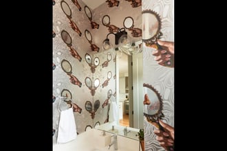 Mirror, mirror on the wall...who's one of the prettiest papers of them all? Sorry, had to, but the answer is clearly About Face, which makes a splash in this JL Design Nashville powder room. Photography by: Leslee Mitchell Photography