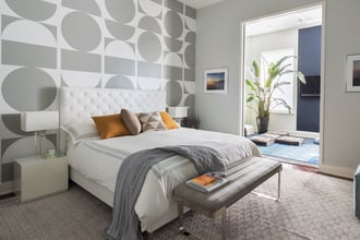 Despite its dynamic design, Brasilia (in a custom colorway) infuses a sense of soothing sophistication in this Michael Garvey designed Brooklyn bedroom.    The large-scale geometric pattern, which is created by the crew at Kravitz Design, can be hung straight across or as the upside-down flip pictured here, or anyway in between. Photography by: Greg Endries