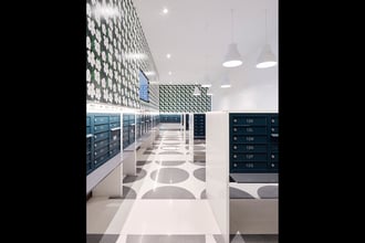 Designed by NYC based Bromley Caldari Architects, this letter-perfect mailroom is poppin' with our Warhol Small Flowers EZ Papes in Blanc. Photo cred: Van Sarki | @vansarki