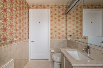 Meteor Flower in Mayan Regency adds color and depth to an unassuming bathroom.