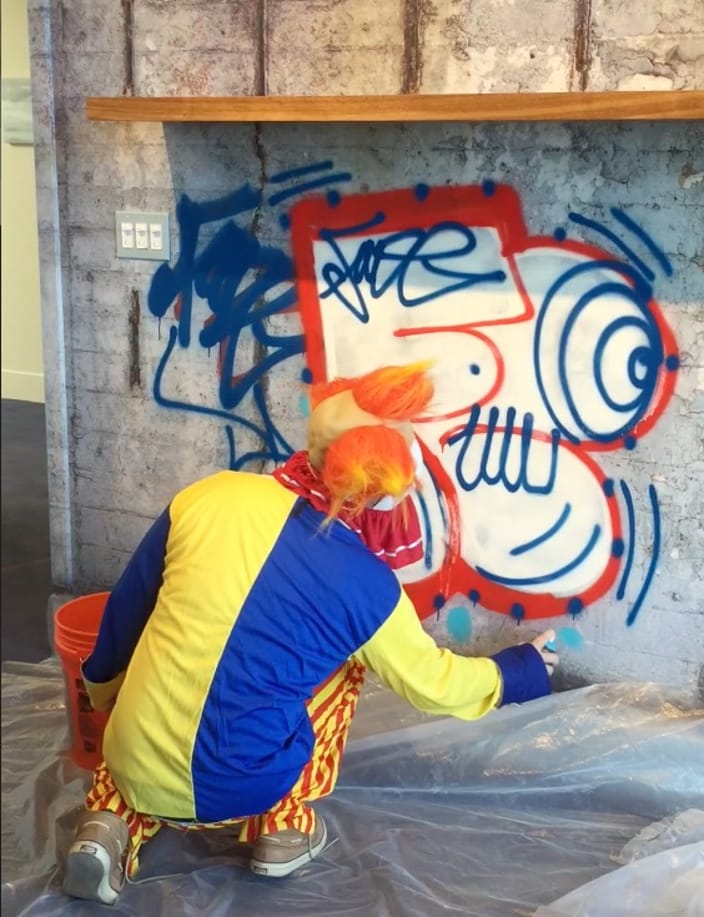 The one and only Fade live tagged our Brooklyn Bridge Wall design in Anne Pasternak's office...in full clown attire, of course.