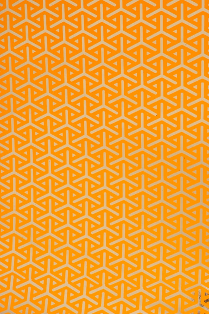 Available in four colorways, including Pumpkin (shown), Silver, Gold, and Licorice, Vapor is a traditional Asian repeat with serious history--the origins of this tortoiseshell motif stem from Japanese armor. This version from the original '70's work of Ted creates a deceptively simple geometric that recurs into another dimension.