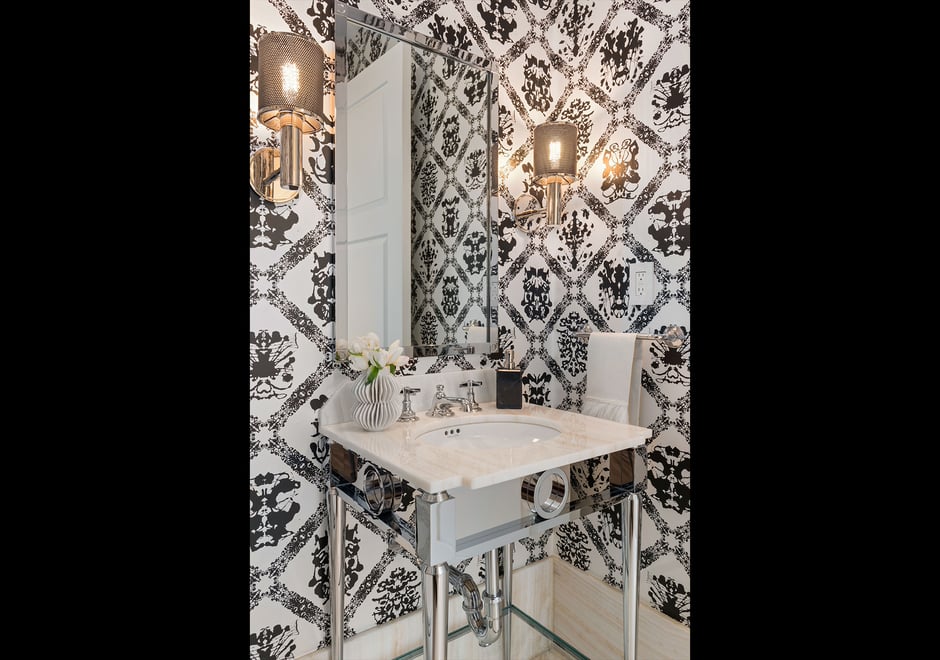 Designed by MHM Interiors, this Four Seasons NY powder room is big on personality thanks to our Andy Warhol Rorschach wallpaper. Photography by: Ryan Brown