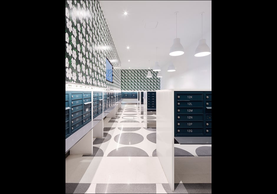 Designed by NYC based Bromley Caldari Architects, this letter-perfect mailroom is poppin' with our Warhol Small Flowers EZ Papes in Blanc. Photo cred: Van Sarki | @vansarki