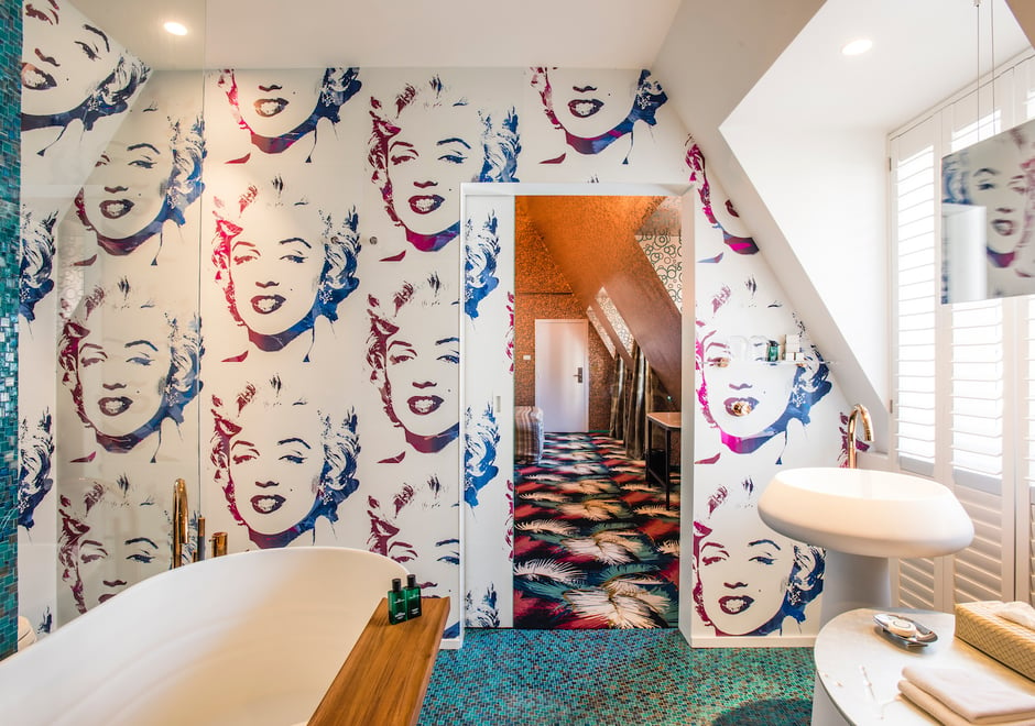 Our Andy Warhol Marilyn Monoprint makes a splash in the Luxury Suite at Hotel De Witte Lelie in Antwerp. Shown in White on reflective Chrome Mylar, this beauty is also available in Black, Diamond Dust Hot Pink and Gold Diamond Dust.