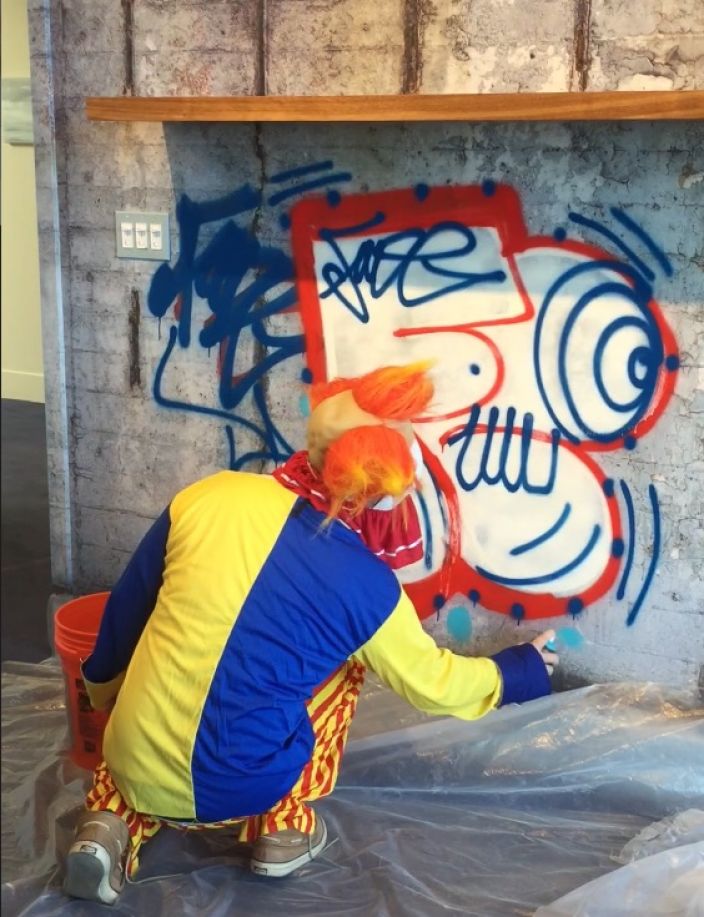 The one and only Fade live tagged our Brooklyn Bridge Wall design in Anne Pasternak's office...in full clown attire, of course.