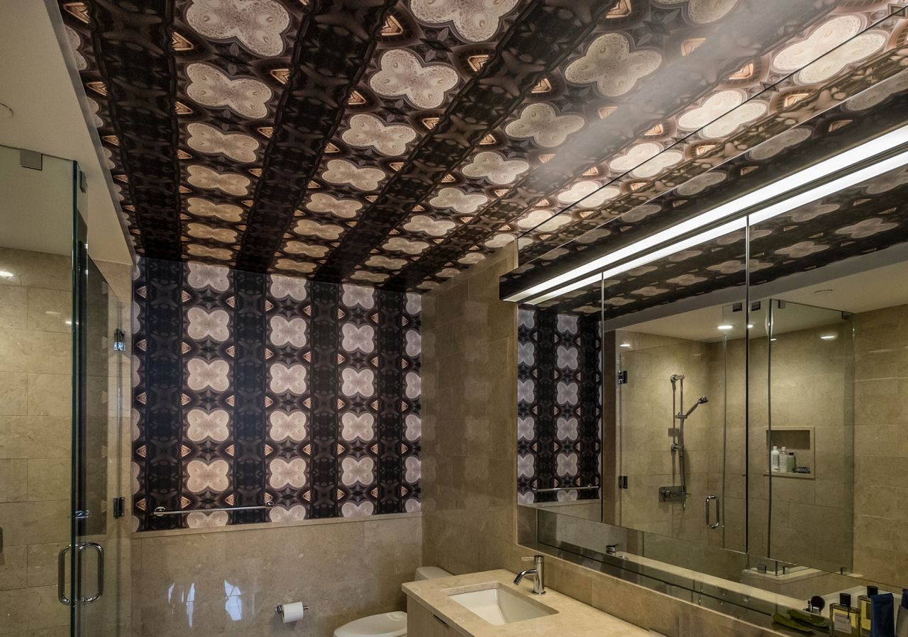 Di Sotto In Su adds a dramatic flair to this bathroom with a wall to ceiling wrap. This version is the small scale, but it can be much larger for the right space!