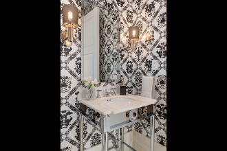 Designed by MHM Interiors, this Four Seasons NY powder room is big on personality thanks to our Rorschach wallpaper. Photographer by: Ryan Brown