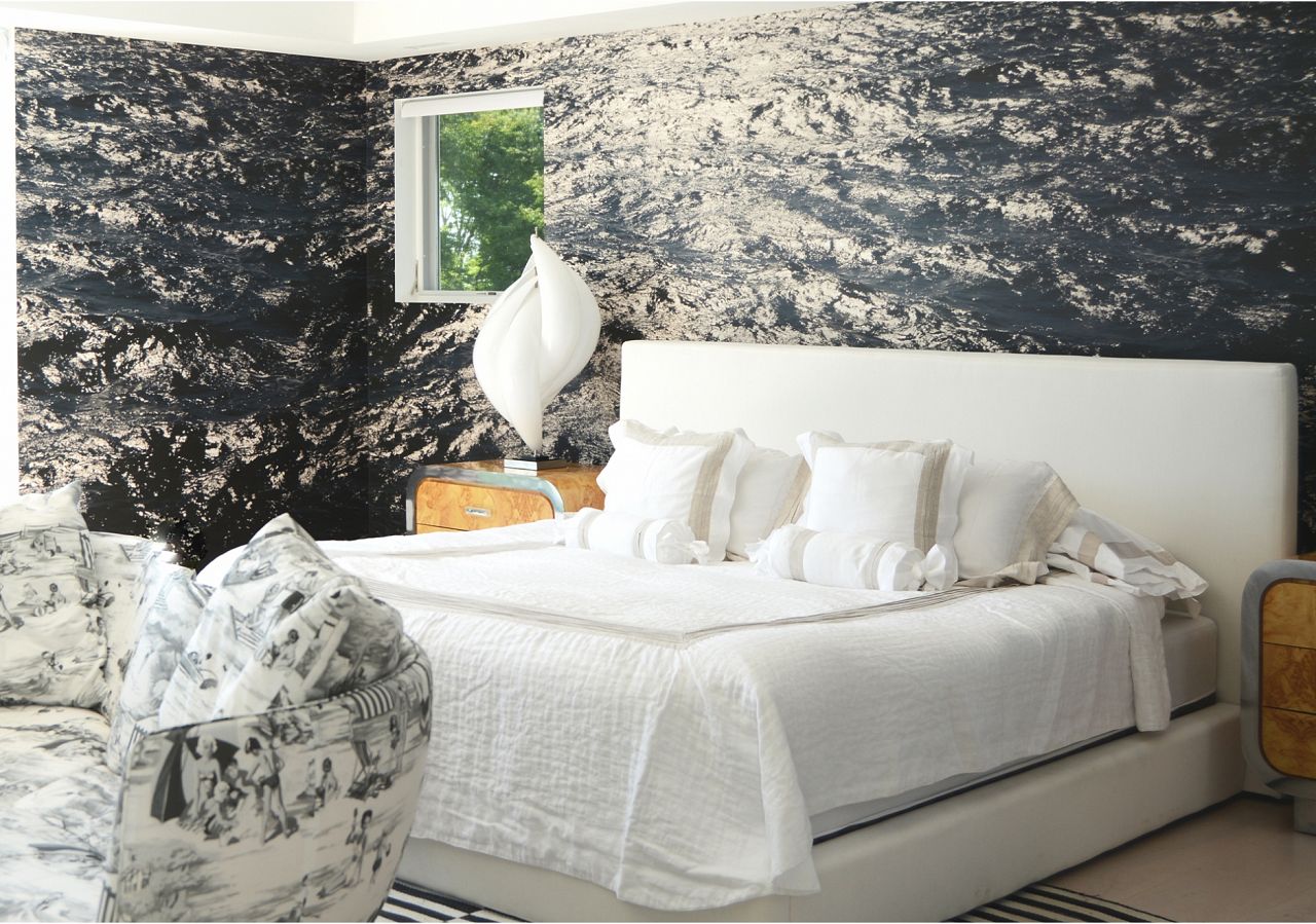Who needs to live on the water when Shimmer can wash a room with similar soothing feels...for way less. Here, Sasha gave the primary bedroom the tranquil treatment with the Boone Speed designed mega mural.  