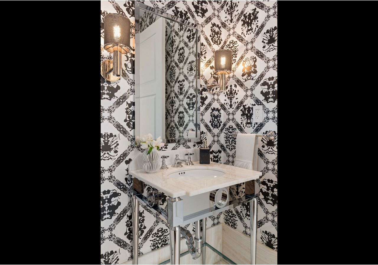 Designed by MHM Interiors, this Four Seasons NY powder room is big on personality thanks to our Rorschach wallpaper. Photographer by: Ryan Brown 