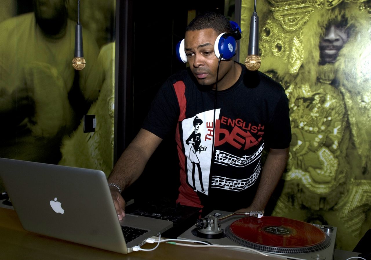 DJ Emz dropping Brazillian beats from the Digital Flavor covered DJ Booth